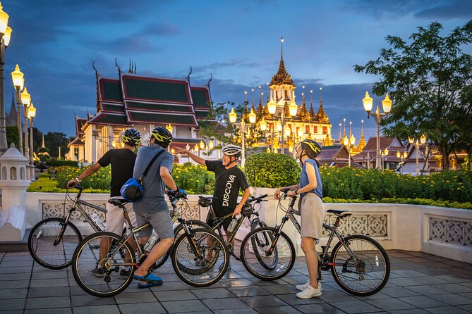 Bangkok: Night Bike Tour with Temples & Flower Market Visit - Crossing the Chao Phraya River by local ferry