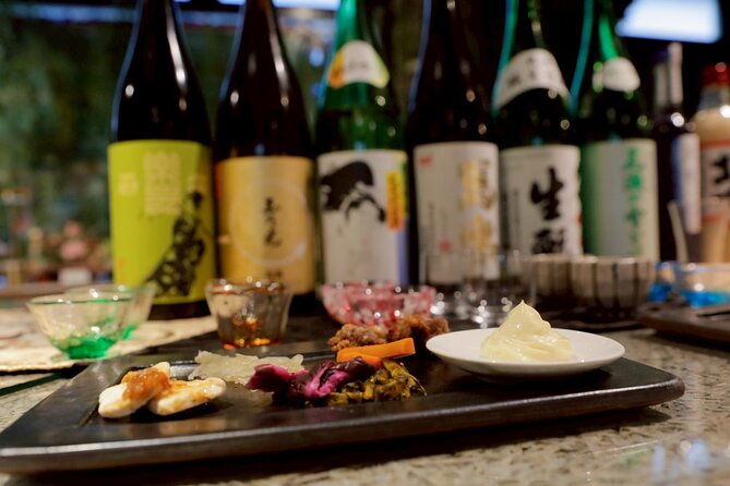 Cherry blossom & Japanese Sake Tasting in Shinjuku - Traditional snacks that change the taste
