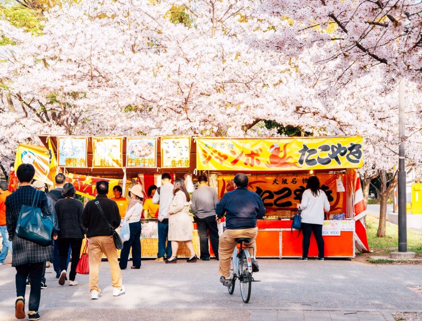 Osaka: Daytime Hanami (Cherry Blossom) and Food Tour - Seasonal stalls, local drinks, and several food stops
