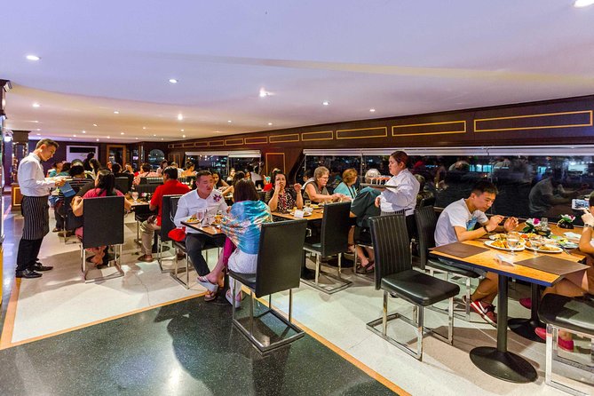 The White Orchid: Chao Phraya Dinner Cruise Experience - Wat Arun and the Grand Palace after dark