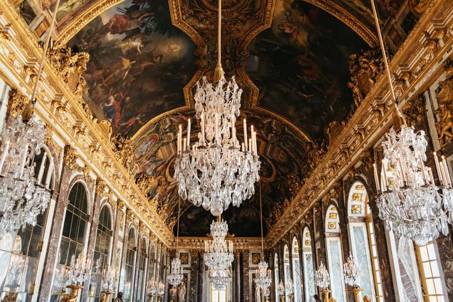 Versailles: Palace, Gardens & Queen’s Estate Guided Tour - Walking the formal gardens and grand fountains
